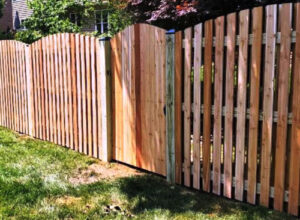 wood picket fence with privacy gate
