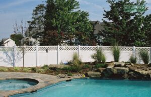 white vinyl fence next to swimming pool