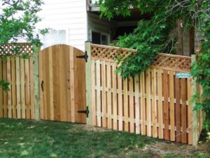 This Wyngate style fence with diamond lattice flows nicely down the slope on this home in Pasadena Maryland. Always try to keep the gate on the flattest grade possible.